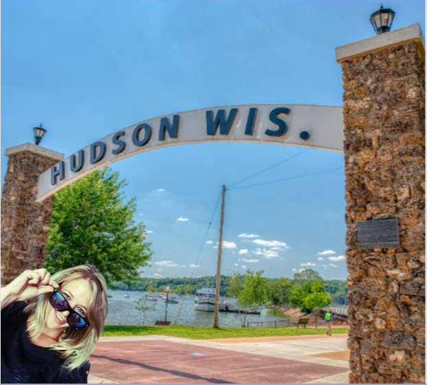 Claire in front of the Hudson, Wisconsin sign